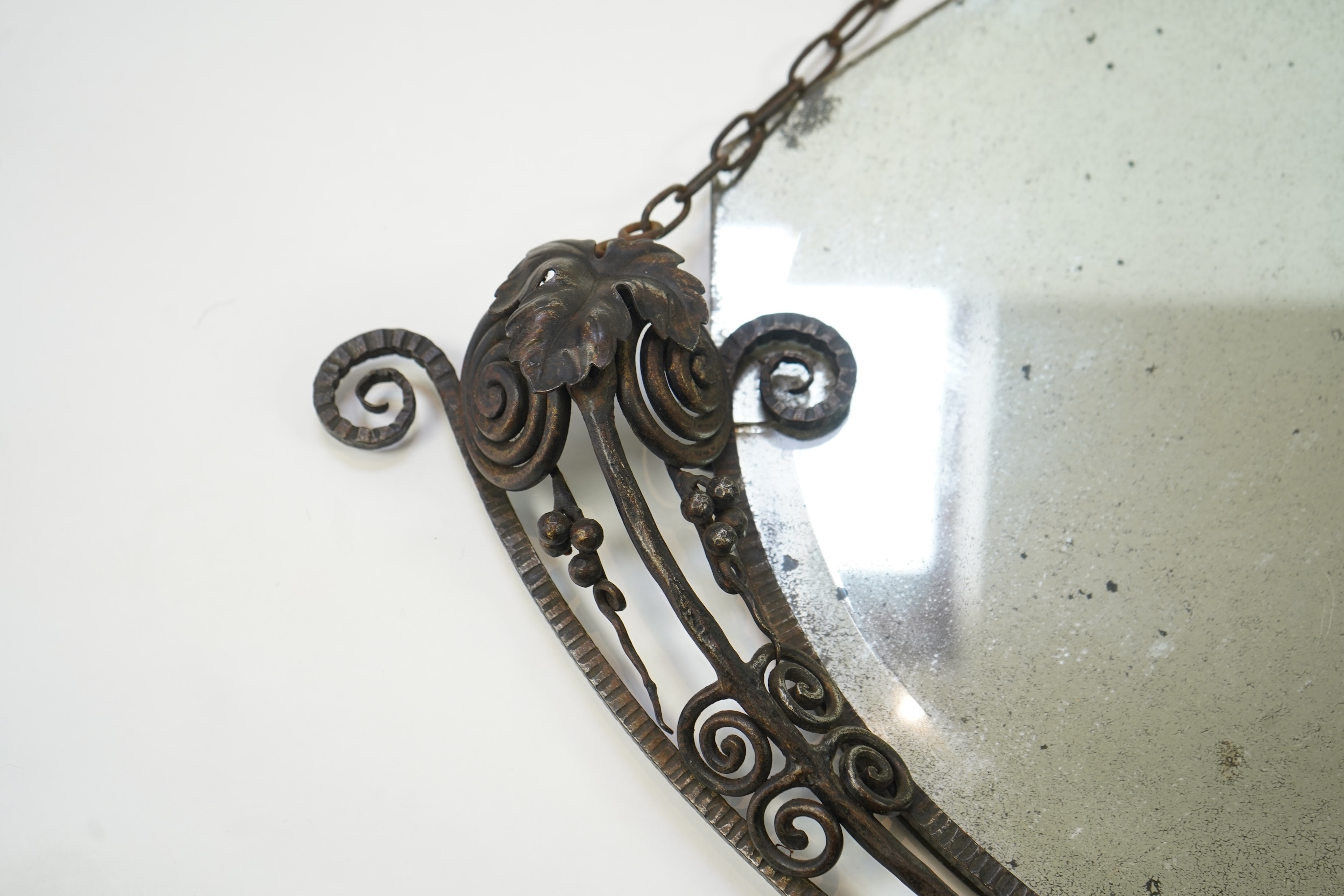 Manner of Edgar Brandt (French, 1880-1960): An Art Deco style wall mirror